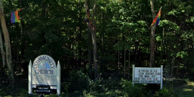 Front Community Church of Chesterfield (UCC) signs decorated with rainbow LGBT flags.