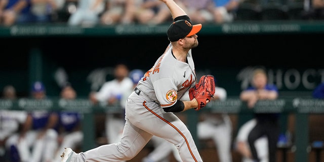 April 3, 2023;  Arlington, Texas, United States;  Baltimore Orioles reliever Danny Coulombe (54) throws a pitch to the Texas Rangers during the second inning at Globe Life Field.