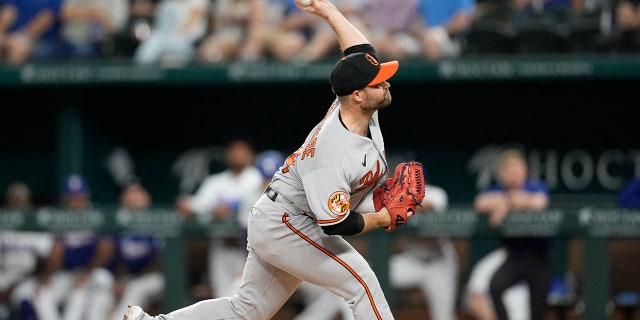 Apr 3, 2023; Arlington, Texas, USA; Baltimore Orioles relief pitcher Danny Coulombe (54) delivers a pitch to the Texas Rangers during the second inning at Globe Life Field.