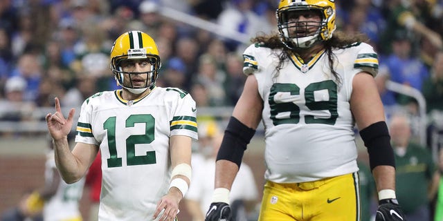 Aaron Rodgers (12) and David Bakhtiari (69) of the Green Bay Packers walk to the line during the second quarter of a game against the Detroit Lions at Ford Field on January 1, 2017 in Detroit.