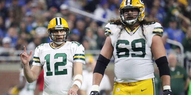 Aaron Rodgers (12) and David Bakhtiari (69) of the Green Bay Packers walk to the line during the second quarter of a game against the Detroit Lions at Ford Field on January 1, 2017 in Detroit.