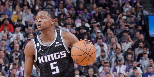 De'Aaron Fox #5 of the Sacramento Kings dribbles the ball against the Golden State Warriors during Round 1 Game 2 of the 2023 NBA Playoffs on April 17, 2023 at Golden 1 Center in Sacramento, California.