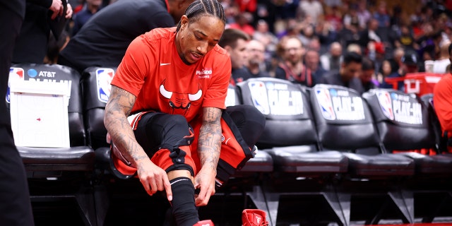 DeMar DeRozan of the Chicago Bulls puts on his sneakers before the Raptors game on April 12, 2023, at the Scotiabank Arena in Toronto, Canada.