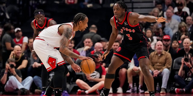 DeMar DeRozan of the Chicago Bulls dribbles the ball against O.G. Anunoby of the Raptors during the Play-In Tournament at the Scotiabank Arena on April 12, 2023, in Toronto.