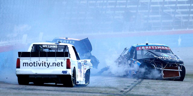 Armani Williams, driver of the Blue Sprig/Motivity Toyota, Trey Hutchens, of the #Quality Roof Seamers Chevrolet, and Dean Thompson, of the Thompson Pipe Group Toyota, during the NASCAR Craftsman Truck Series SpeedyCash.com 250 on April 01, 2023 in Fort Worth, Texas.