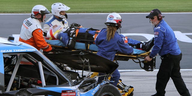 Dean Thompson is rushed to an ambulance during the SpeedyCash.com NASCAR Craftsman Truck Series 250 at Texas Motor Speedway on April 1, 2023 in Fort Worth.