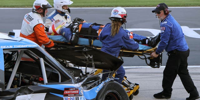 Dean Thompson is carried to an ambulance during the NASCAR Craftsman Truck Series SpeedyCash.com 250 at Texas Motor Speedway on April 1, 2023, in Fort Worth.