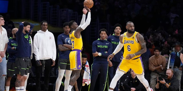 Lakers guard Dennis Schroder makes a 3-point basket in the closing seconds of the fourth quarter against the Minnesota Timberwolves on Tuesday, April 11, 2023, in Los Angeles.