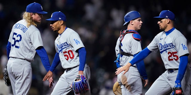 Los Angeles Dodgers celebrate after their 10-5 victory over the Giants in San Francisco, Wednesday, April 12, 2023.