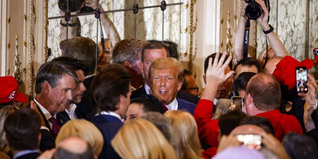 Former US President Donald Trump departs after delivering remarks at the Mar-a-Lago Club