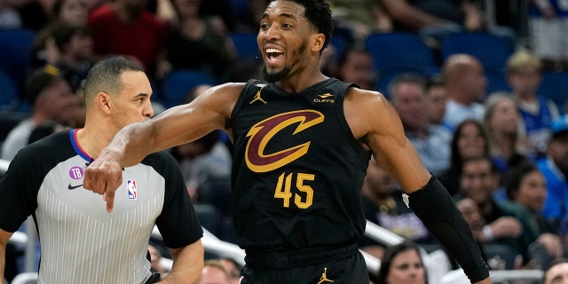 Cleveland Cavaliers' Donovan Mitchell celebrates after making a 3-point shot against the Magic, Tuesday, April 4, 2023, in Orlando, Florida.