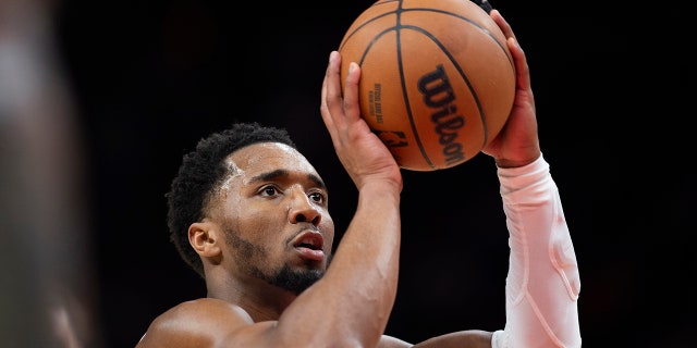Cleveland Cavaliers guard Donovan Mitchell shoots a foul shot against the Hawks, Tuesday, March 28, 2023, in Atlanta.