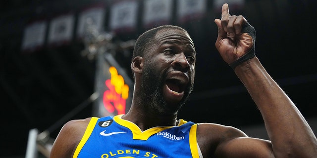 Golden State Warriors forward Draymond Green (23) reacts toward a Denver Nuggets fan in the third quarter at Ball Arena in Denver, Colo., April 2, 2023.