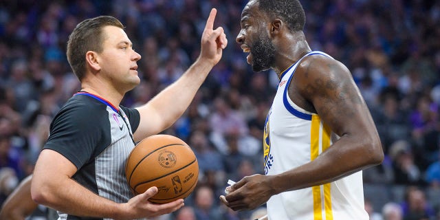 Golden State Warriors forward Draymond Green, right, argues with referee Gediminas Petraitis in the first half during Game 2 in the first round of the NBA basketball playoffs against the Sacramento Kings in Sacramento, Calif., Monday, April 17, 2023.