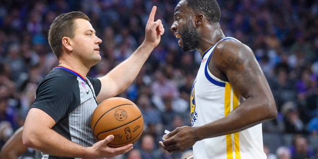 Golden State Warriors forward Draymond Green, right, argues with referee Gediminas Petraitis in the first half during Game 2 in the first round of the NBA basketball playoffs against the Sacramento Kings in Sacramento, Calif., Monday, April 17, 2023. 