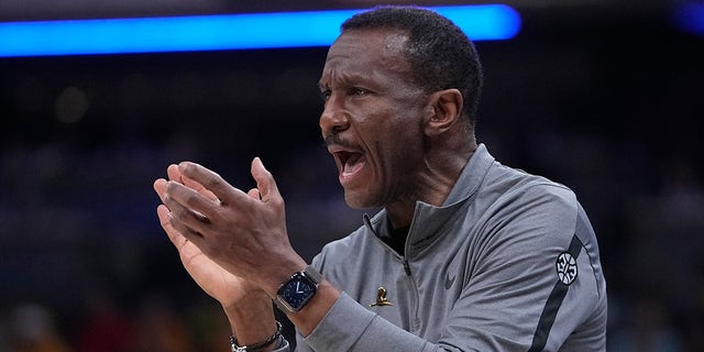 Detroit Pistons coach Dwane Casey applauds during the first half of the team's NBA basketball game against the Indiana Pacers, Friday, April 7, 2023, in Indianapolis.