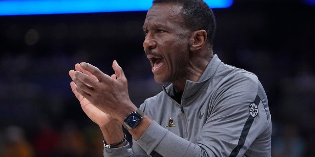 Detroit Pistons coach Dwane Casey applauds during the first half of the team's NBA basketball game against the Indiana Pacers, Friday, April 7, 2023, in Indianapolis.