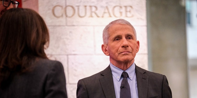Dr. Anthony Fauci stands