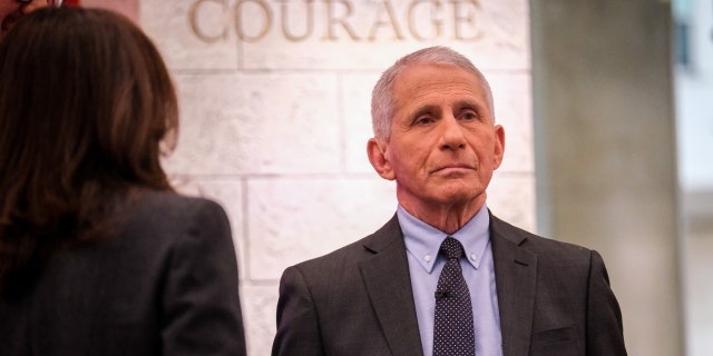 Dr. Anthony Fauci stands