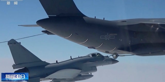 In this image taken from video footage run Saturday, April 8, 2023 by China's CCTV, a Chinese fighter jet performs an mid-air refueling maneuver at an unspecified location. The Chinese military announced exercises around Taiwan on Saturday in a new act of retaliation for a meeting between the U.S. House of Representatives speaker and the president of the self-ruled island democracy claimed by Beijing as part of its territory.