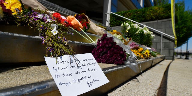 Flowers and a message of hope sit on the steps of the Old National Bank in Louisville, Kentucky.