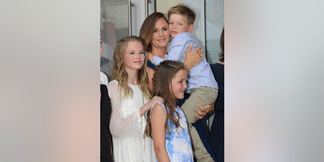 Jennifer Garner poses with her three kids in 2018