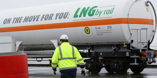 A tank car written with 'On the move for you: LNG by rail' can be seen before loading at the Elbehafen port in Brunsbuettel, Germany, 25 April 2016. 25 April 2016 will be the first time that a tank car is filled with liquified natural gas (LNG) and the Elbehafen port in Brunsbuettel. Photo: BODO MARKS/dpa | usage worldwide (Photo by Bodo Marks/picture alliance via Getty Images)