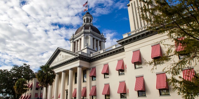 The historic Old Florida State Capitol Building, restored to its 1902 version, sits in front of the current New Capitol completed in 1982, in Tallahassee, Florida.