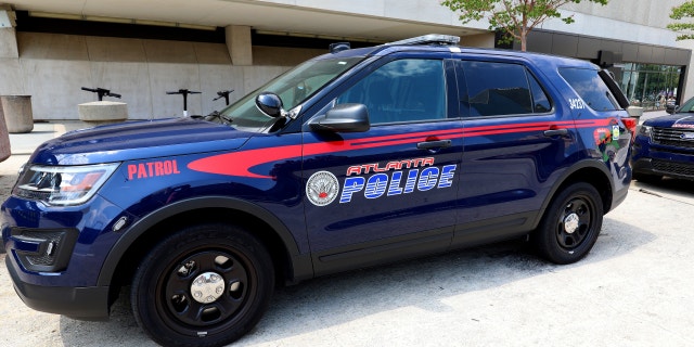 An Atlanta police vehicle sits parked outside State Farm Arena in Atlanta, Georgia on July 28, 2019.