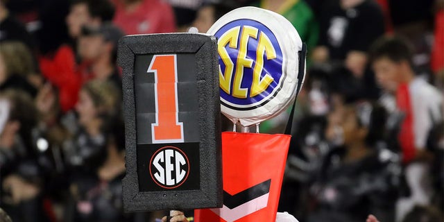 The SEC logo on a yard marker