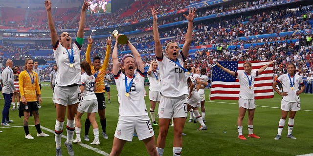 Megan Rapinoe (Reign FC) and Alex Morgan (Orlando Pride) of United States celebrate whit her teammates after winning the 2019 FIFA Women's World Cup France Final match between The United State of America and The Netherlands at Stade de Lyon on July 7, 2019 in Lyon, France.