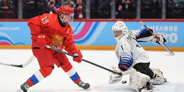 Dylan Silverstein, right, and Matvei Michkov of Russia battle for the puck during the Men's 6-Team Ice Hockey Tournament Finals Gold Medal Game between Russian Federation and United States on day 13 of the Lausanne 2020 Winter Youth Olympics at Lausanne Vaudoise Arena on Jan. 22, 2020 in Lausanne, Switzerland.