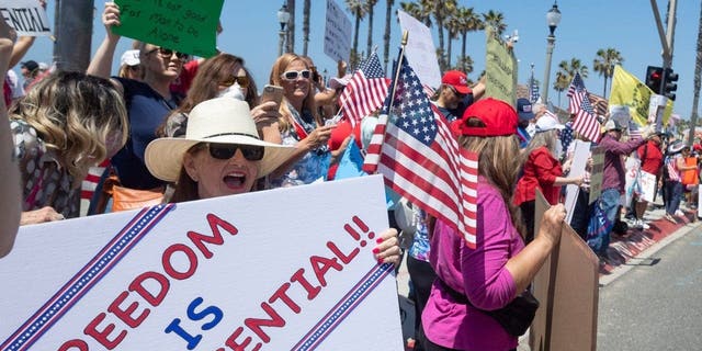 Protestors gather at PCH and Main Street