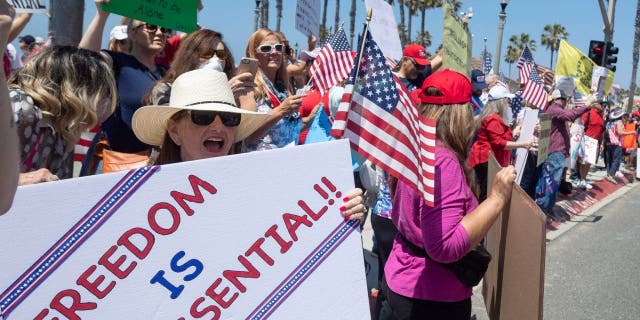 Protestors gather at PCH and Main Street