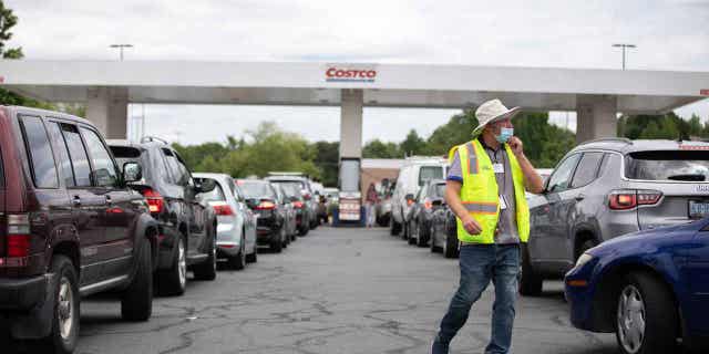 On May 11, 2021, attendants drive cars while queuing to fill their gas tanks at a COSTCO in Charlotte, North Carolina. Wisconsin lawmakers are pushing for a bill that would prevent a ban on gas-powered engines.