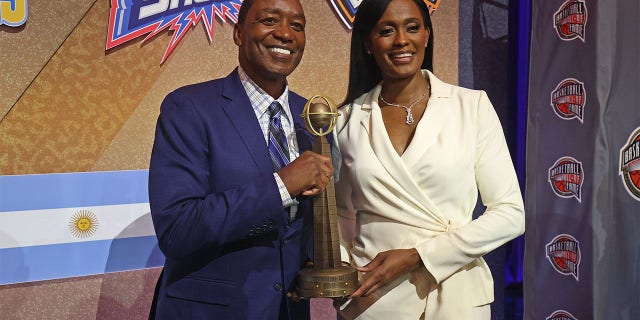 Inductee Swin Cash and Isiah Thomas pose for a portrait with the Hall of Fame Trophy during the 2022 Basketball Hall of Fame enshrinement ceremony Sept. 10, 2022, at Symphony Hall in Springfield, Mass.