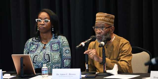 Kamilah Moore, chair of the California Reparations Task Force, left, and Amos Brown right, vice chair, at the California Science Center in Los Angeles on Sept. 22, 2022.