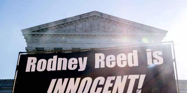 A sign that says "Rodney Reed is innocent" is displayed outside the US Supreme Court in Washington, DC, on Oct. 11, 2022. The Supreme Court ruled on April 19, 2023, that Reed should have a chance to test for DNA that he believes will help clear his name.