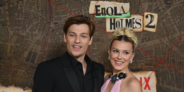 Jake Bongiovi and Millie Bobby Brown arrive for the premiere of Netflix's "Enola Holmes 2" at The Paris Theatre in New York City on October 27, 2022. They made their relationship Instagram official in 2021.