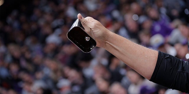 Sacramento Kings fan rings a cowbell