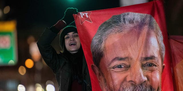 Supporters of Brazil's president, Luiz Inacio Lula da Silva, rally in solidarity with Brazilian democracy outside the Brazilian Consulate in Boston on Jan. 9, 2023.