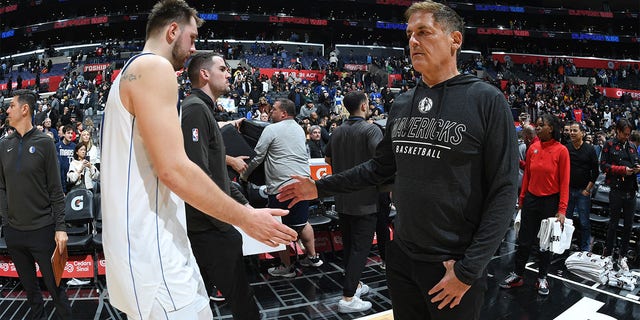 Luka Doncic of the Dallas Mavericks and team owner Mark Cuban shake hands during the game against the Los Angeles Clippers at Crypto.Com Arena in Los Angeles on January 10, 2023.