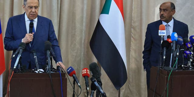 Russian Foreign Minister Sergei Lavrov, left, and Sudanese acting foreign minister Ali al-Sadiq give a joint press conference at the airport in Khartoum on Feb. 9, 2023 during an official visit to Sudan.