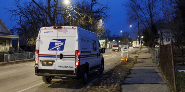 A United States Postal Service van sits in Chicago's West Pullman neighborhood shortly after sunset on Feb. 8, 2023.