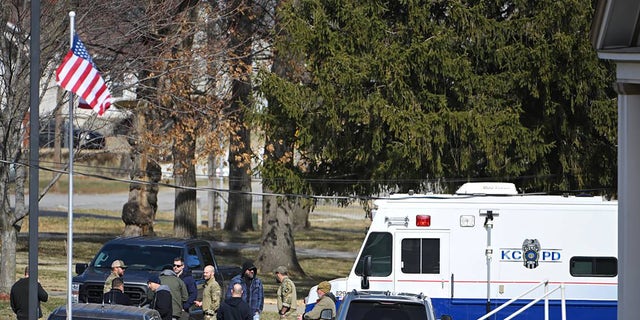 Law enforcement officers investigating the shooting of a black teen in Kansas City, Missouri.