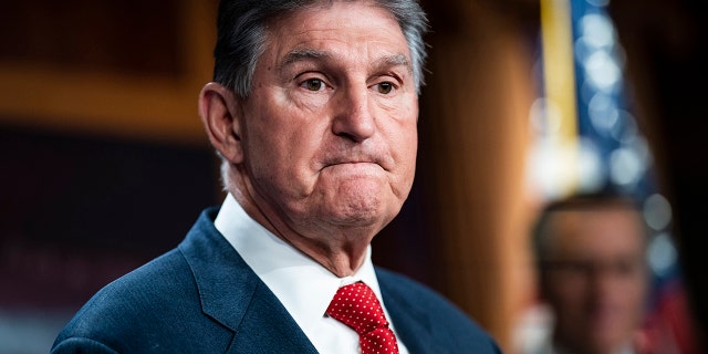 Joe Manchin wearing a suit and tie