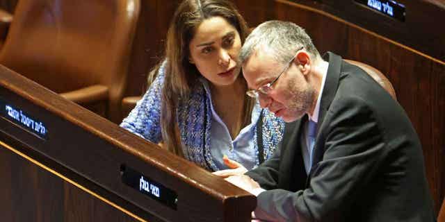 Israeli Justice Minister Yariv Levin and May Golan