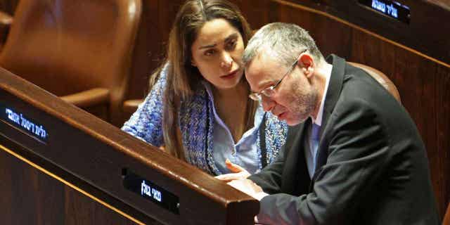Israeli Justice Minister Yariv Levin and May Golan