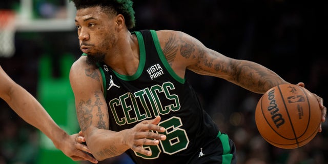 Celtics' Marcus Smart drives to the basket against the San Antonio Spurs at TD Garden on March 26, 2023 in Boston.