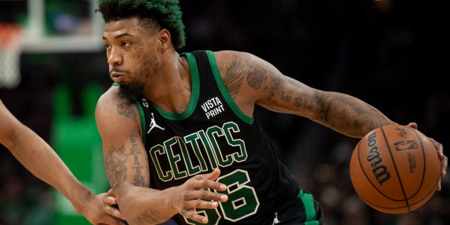 Marcus Smart of the Celtics drives to the basket against the San Antonio Spurs at TD Garden on March 26, 2023, in Boston.